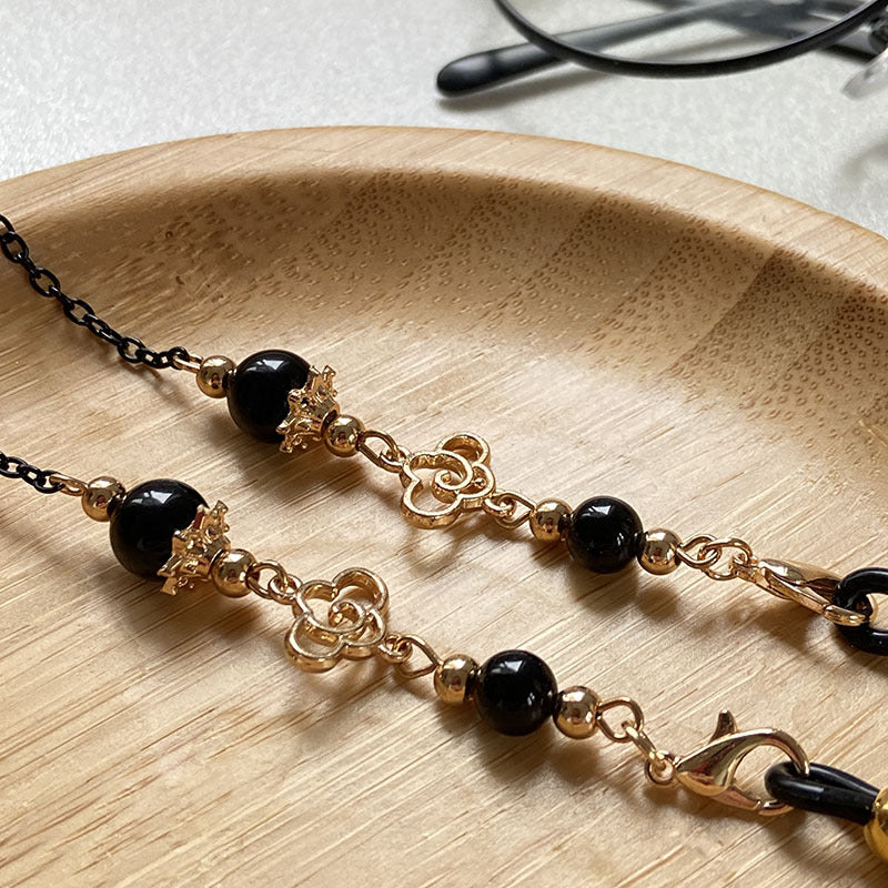 Filigree glasses chain holder with pearls and golden accents Stornfield