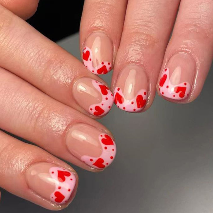 Artfully designed nail tips with heart motifs Stornfield