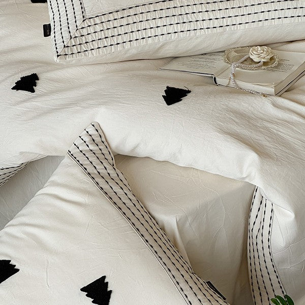 Linen-cotton blend duvet cover set with embroidered accent motifs and striped border