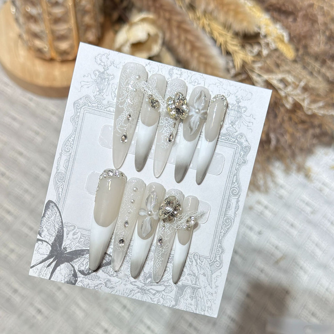Decorative Stiletto Press-On Nail Art Set with Elegant Lace and Gemstone Accents Stornfield