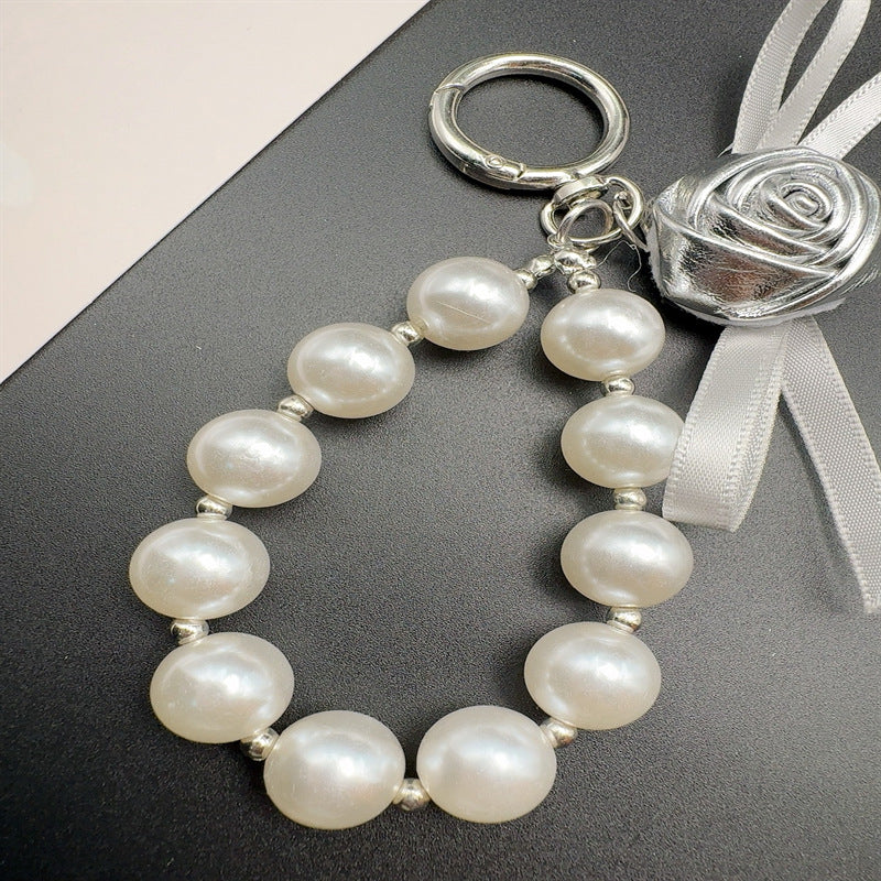 Elegant Pearl and Leather Charm Keychain Stornfield