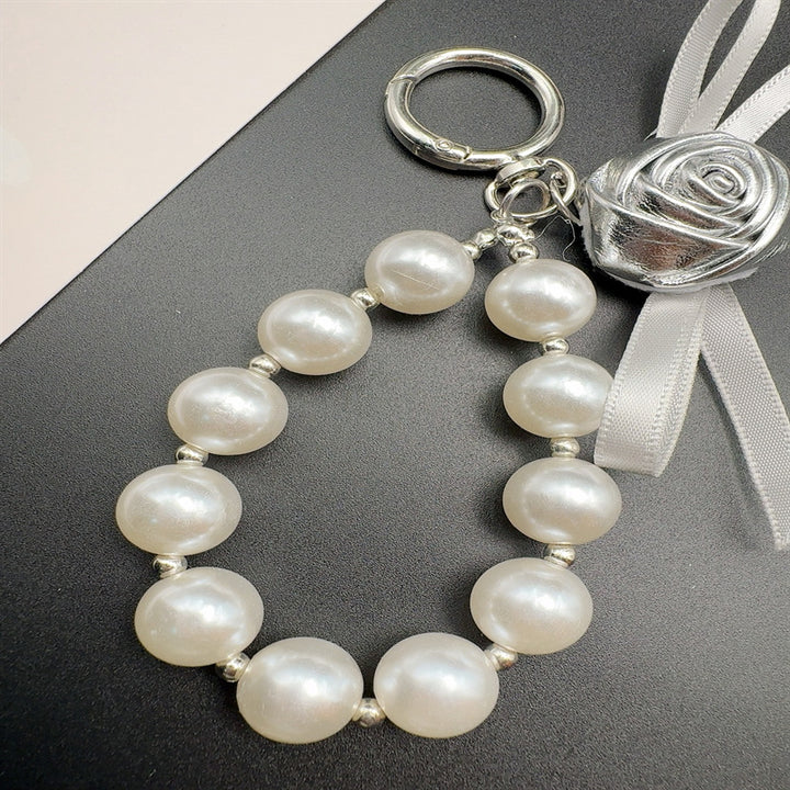 Elegant Pearl and Leather Charm Keychain Stornfield