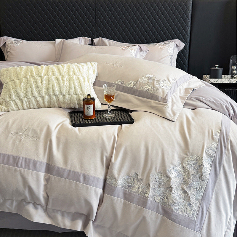 Hotel-style bedding set made of cotton satin with embroidered rose relief and fine border