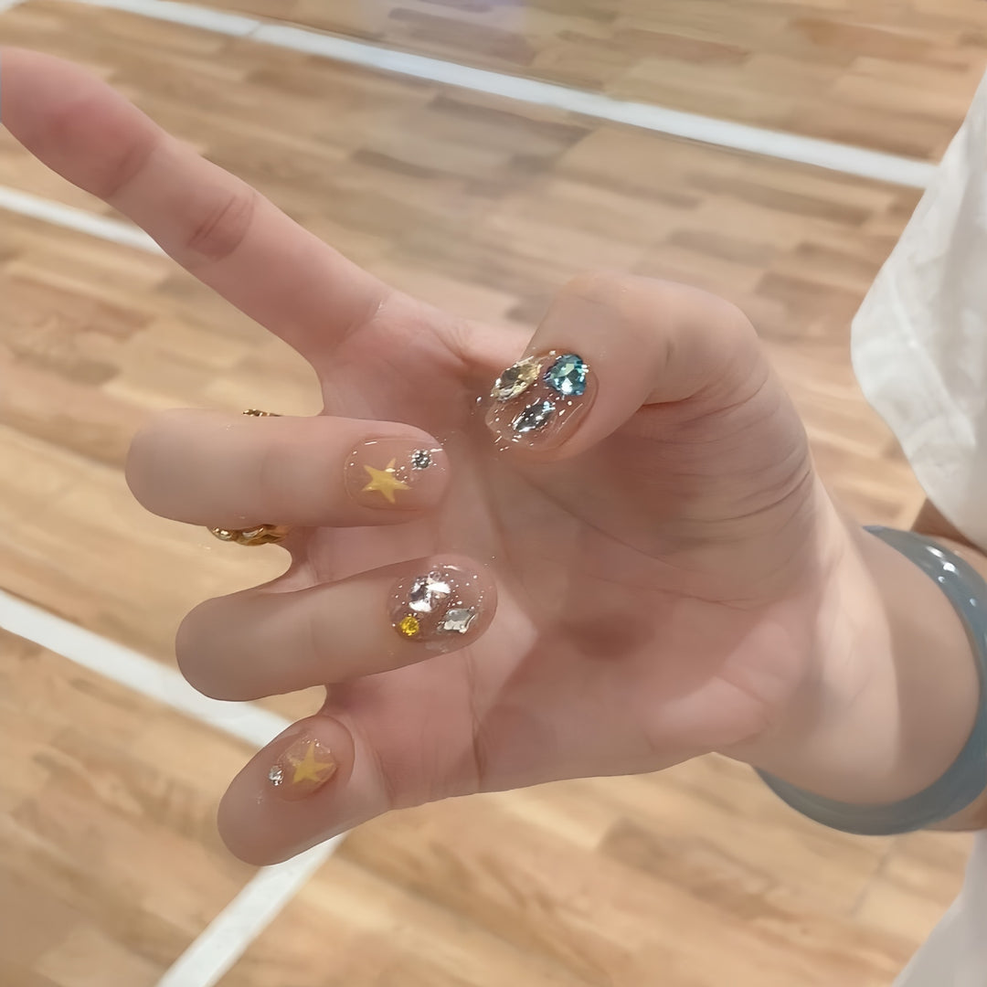 Glittering nail tips with elegant jewelry accents Stornfield