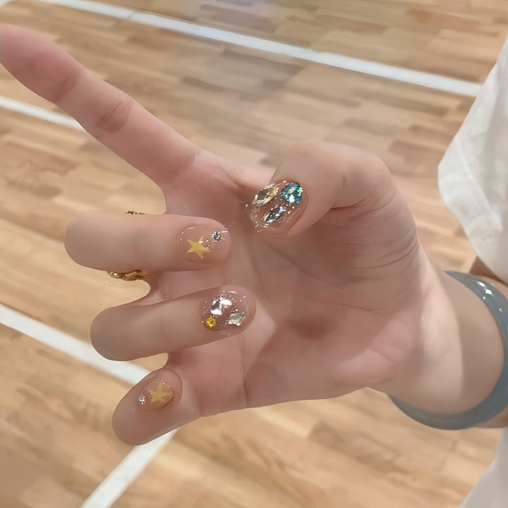 Glittering nail tips with elegant jewelry accents Stornfield
