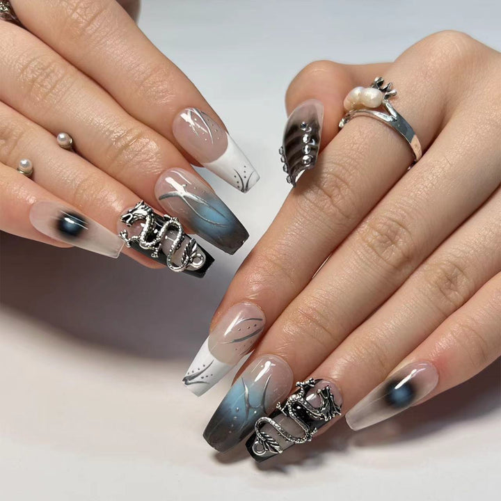 Artistic acrylic nails in elegant ombre design with elaborate details Stornfield