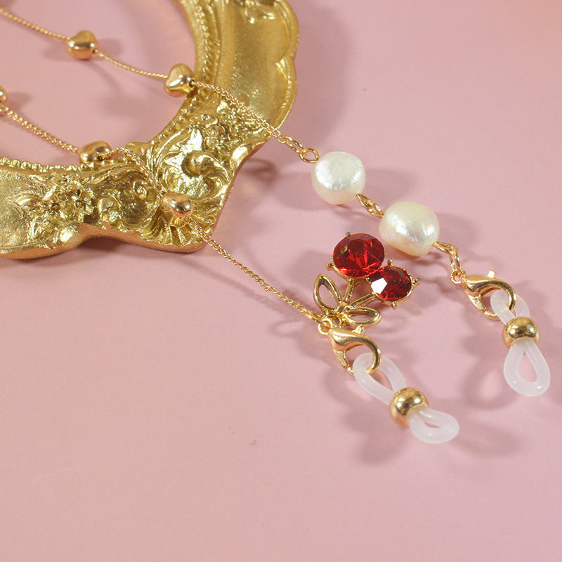 Elegant jewelry ribbon with pearls and silver accents Stornfield