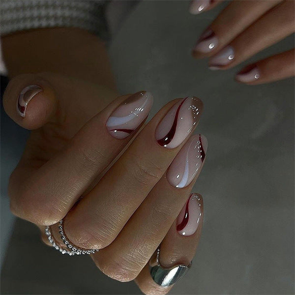 Elegant Nail Art with Modern Wave Pattern and Glitter Accents Stornfield