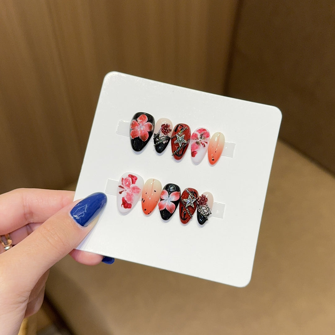 Art nail set with floral motifs and glitter accents Stornfield