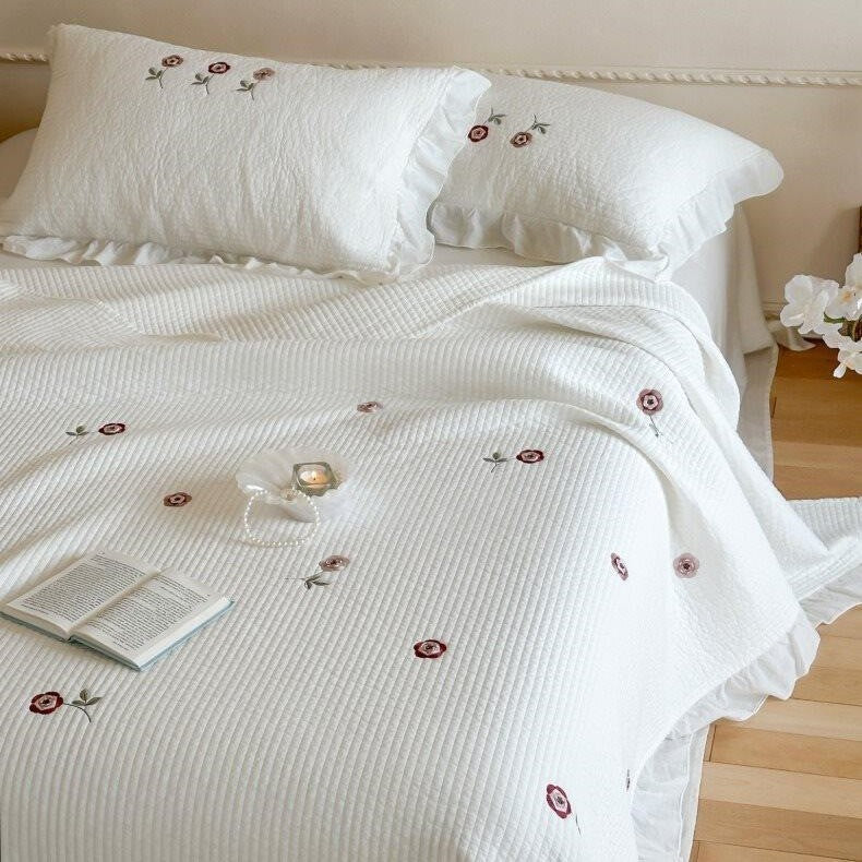 Quilted bedspread and cushion set with frill and delicate flower embroidery