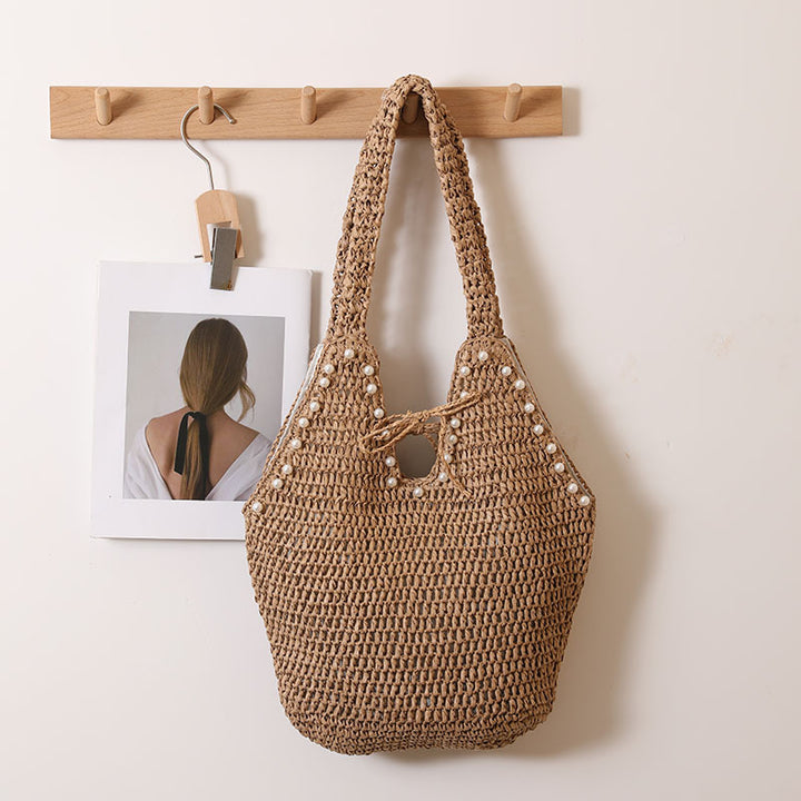 Handbag with pearl decor and innovative closure Stornfield
