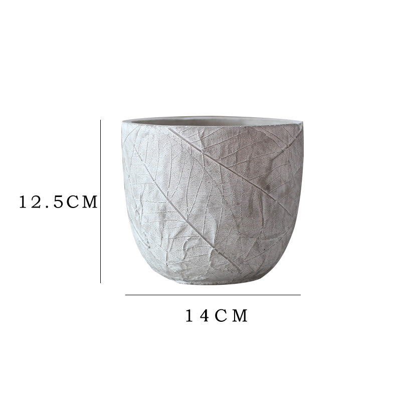 Decorative plant container made of handmade ceramic with leaf pattern Stornfield