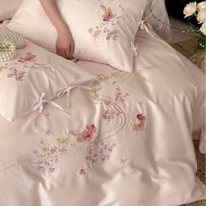 Embroidered satin bedding set with ribbon ties and delicate floral embroidery Stornfield