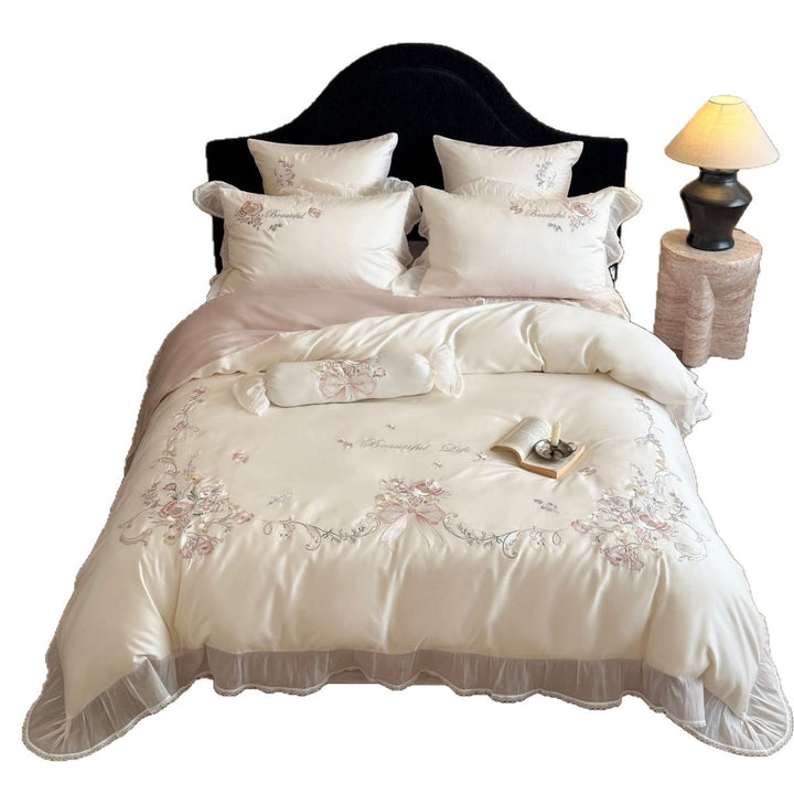Embroidered satin bedding set with frill, ruffles, and decorative pillow