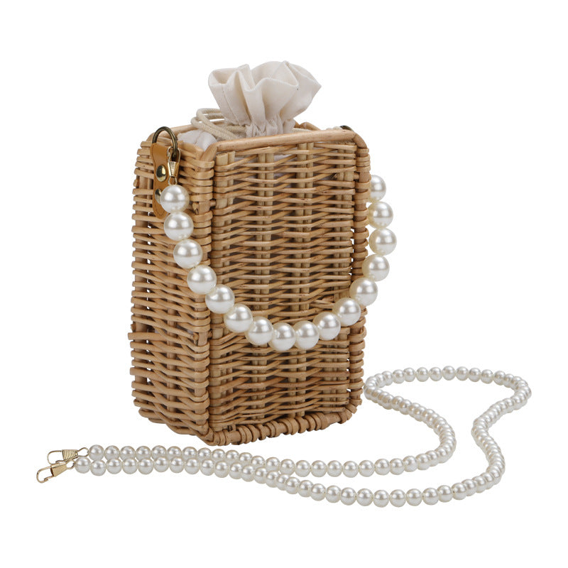 Women's handbag made of woven material with pearl accents Stornfield