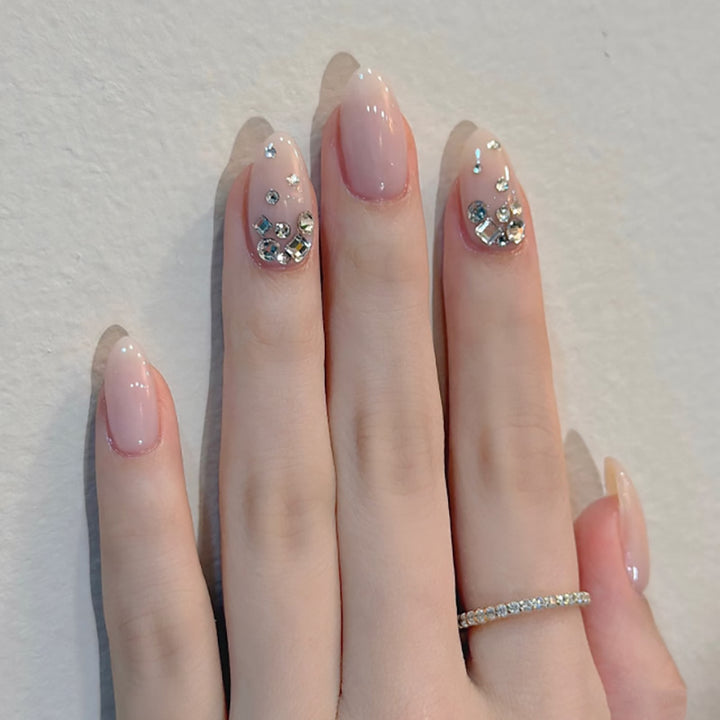 Artful nail art with delicate glitter accents and elegant French tip Stornfield