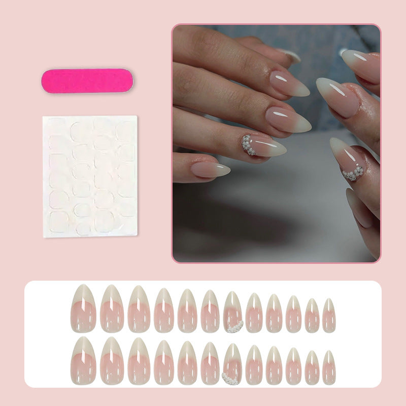 Acrylic nail set with elegant French tip and extravagant decorative details Stornfield
