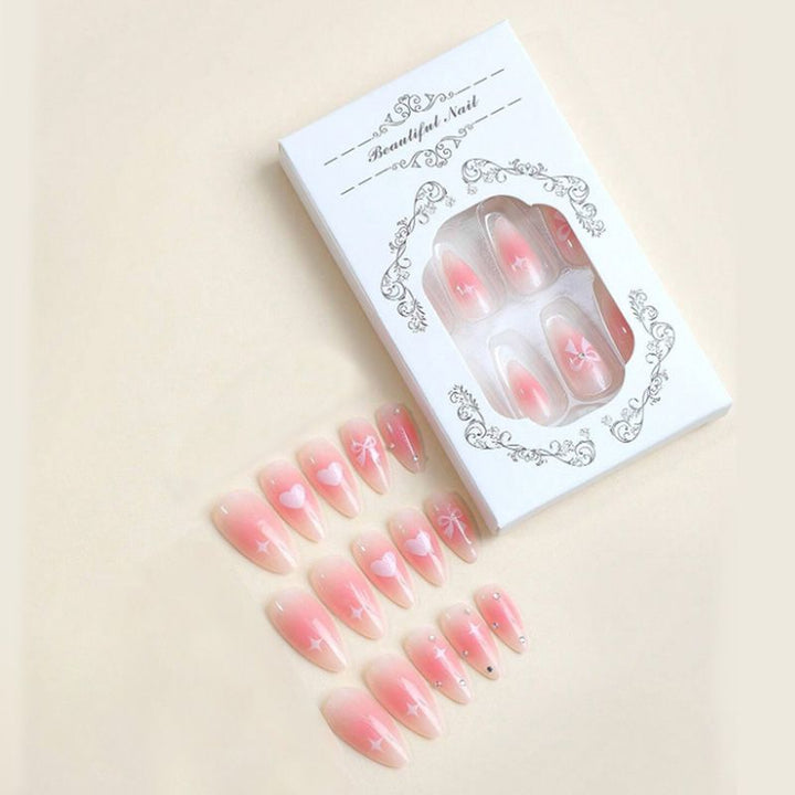 Artificial nail set with delicate bow embellishments Stornfield