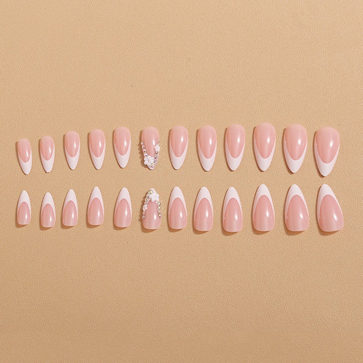 Artificial nails with elegant French tips and rhinestone details Stornfield