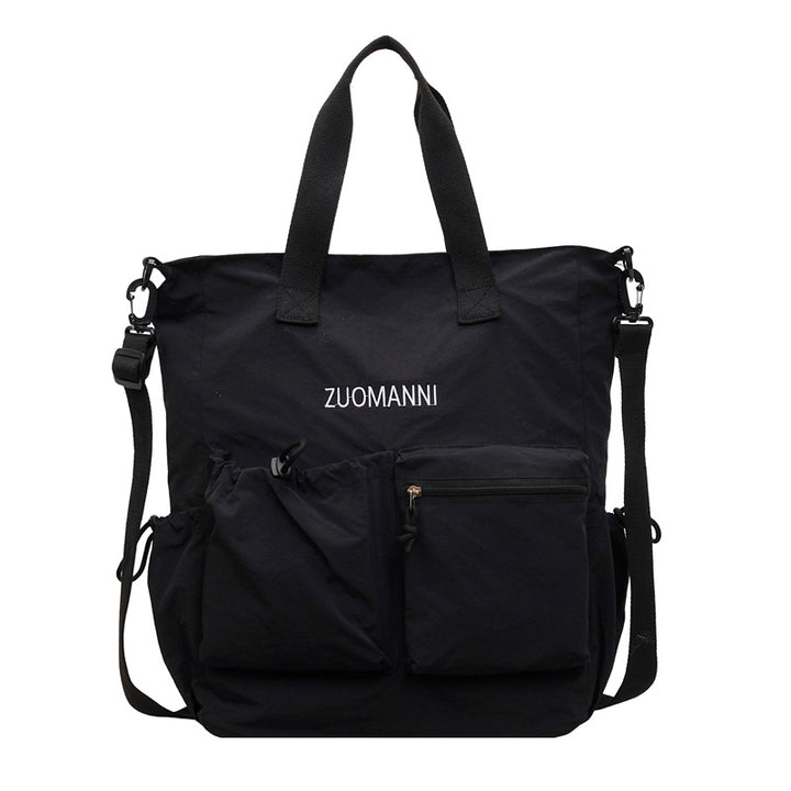 Tote bag with multifunctional outer pockets and adjustable shoulder strap Stornfield