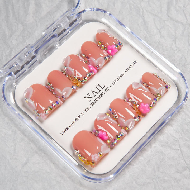 Decorative Press-On Nail Set with Soft Pink Accents and Gem Details