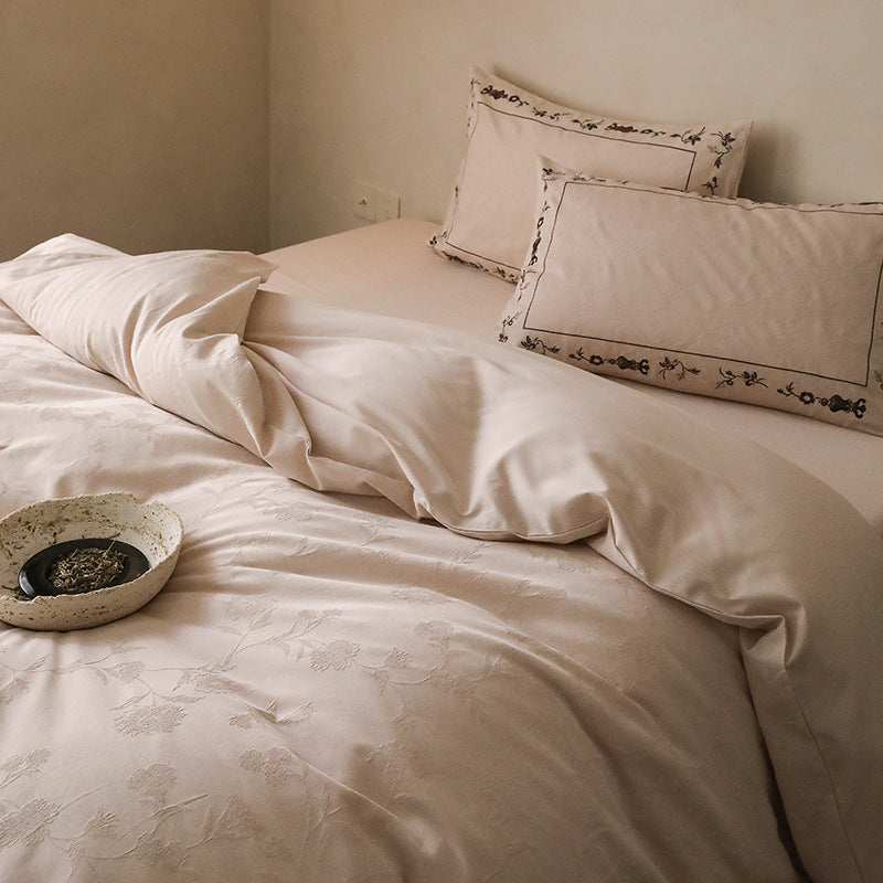 Exclusive cotton satin bedding set with tonal floral jacquard and fine decorative embroidery
