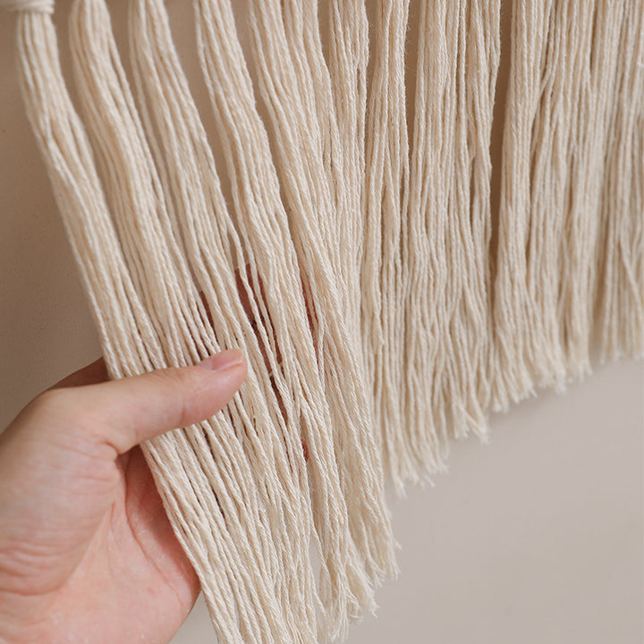 Woven wall hanging with hand-knotted fringes and bunny motif