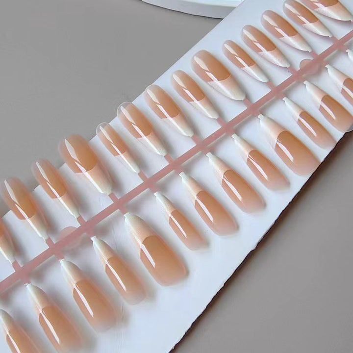Artificial nails in the elegant French tip design Stornfield