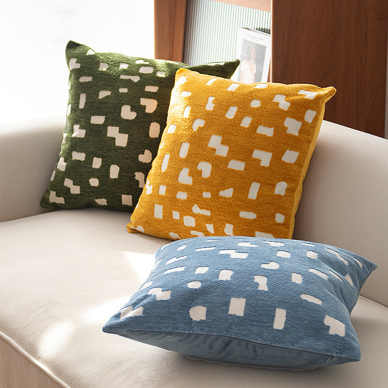 Decorative cushion with abstract pixel pattern and soft bouclé cover