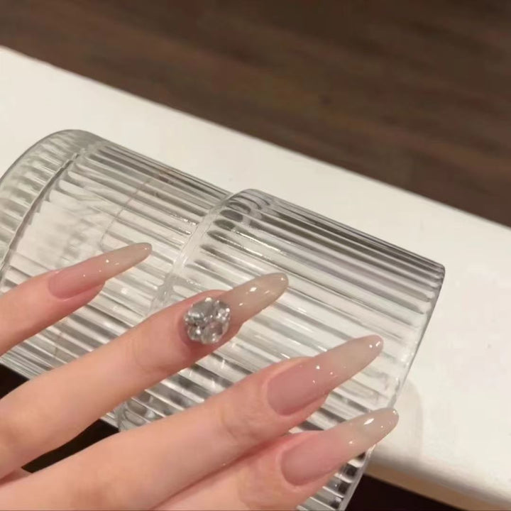Elegant artificial nails with glitter and crystal accents Stornfield