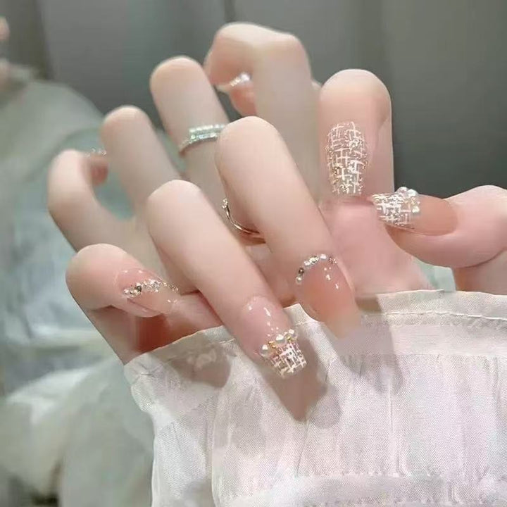 Glamorous artificial nails with rhinestone details Stornfield