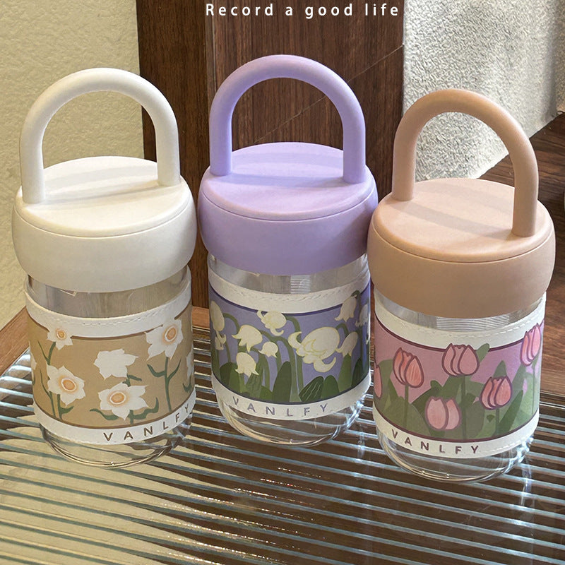 Women's insulated drinking bottle with ergonomic carrying handle and elegant flower design Stornfield