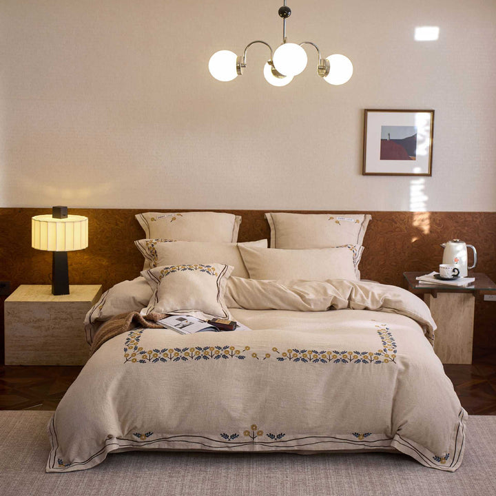 Bedding set with finely embroidered floral border design