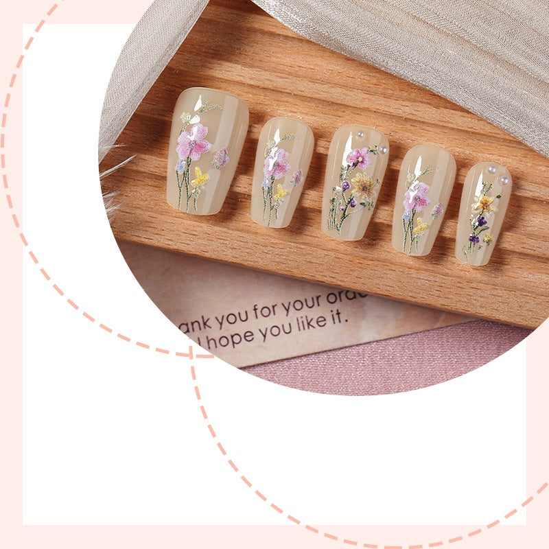 Artificial nail set with floral embellishments and glamorous details Stornfield