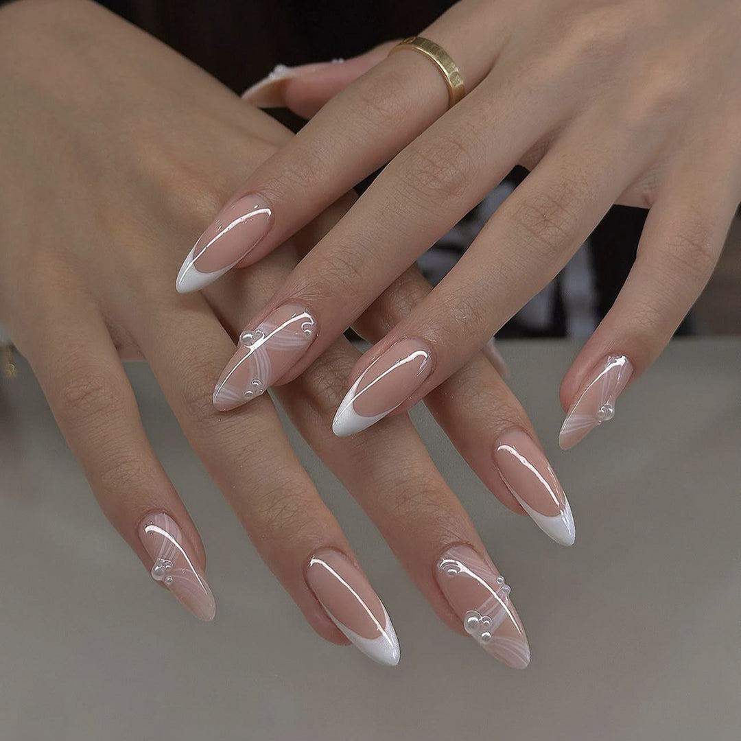 Creative acrylic nail set with elegant tips and glitter decorations Stornfield