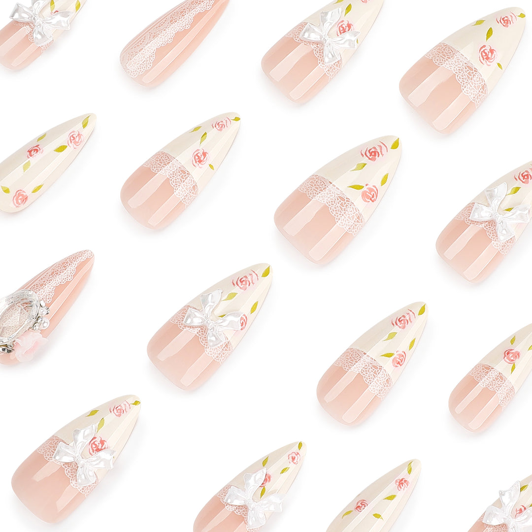 Artful stiletto nails with floral accents and glitter accents Stornfield