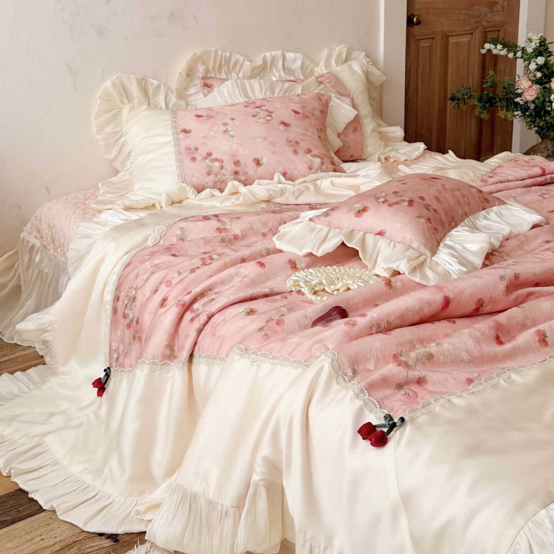 Romantic bedding set with ruffles, quilted bedspread, and decorative pillowcases