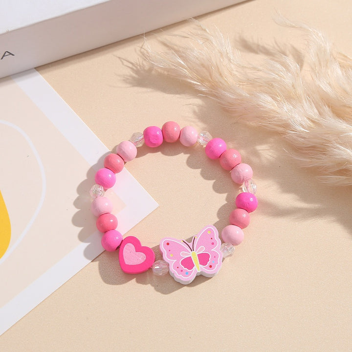 Playful bracelet with heart and butterfly charms Stornfield