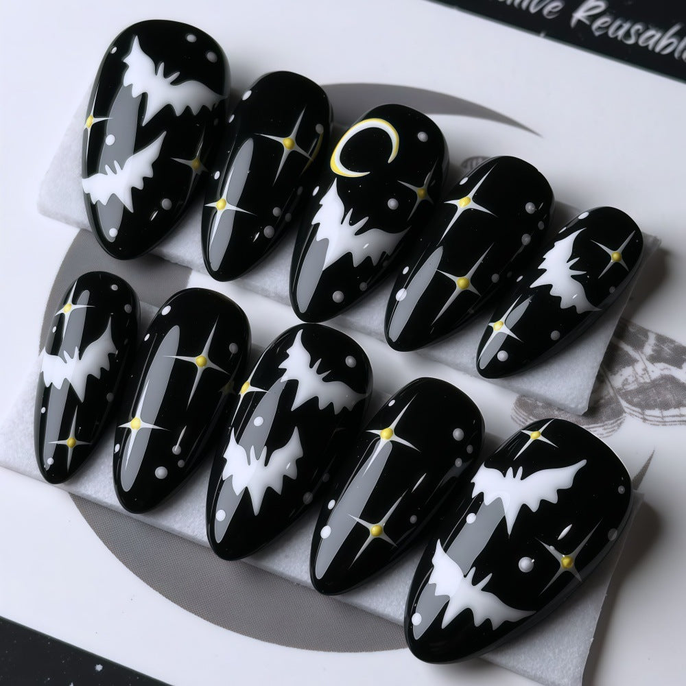 Artificial nails in creative Halloween bat design Stornfield