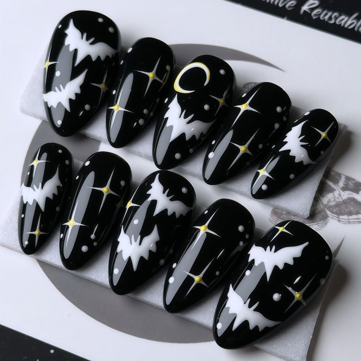 Artificial nails in creative Halloween bat design Stornfield