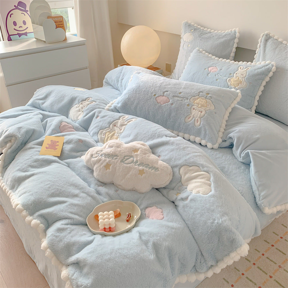 Cozy velvet bedding set for children with embroidered cloud motifs and pompom border