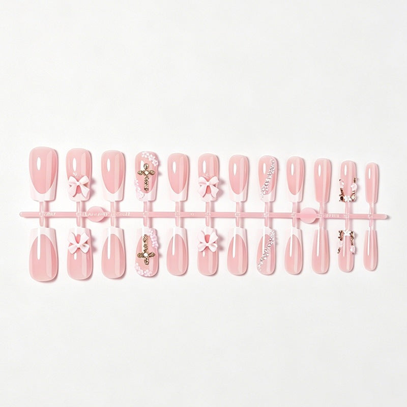 Artificial nail set with elegant bow and glitter elements Stornfield