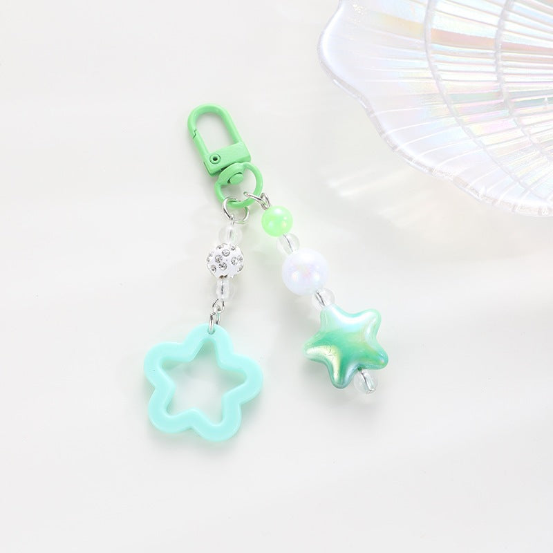 Playful keychain with floral and star motif Stornfield