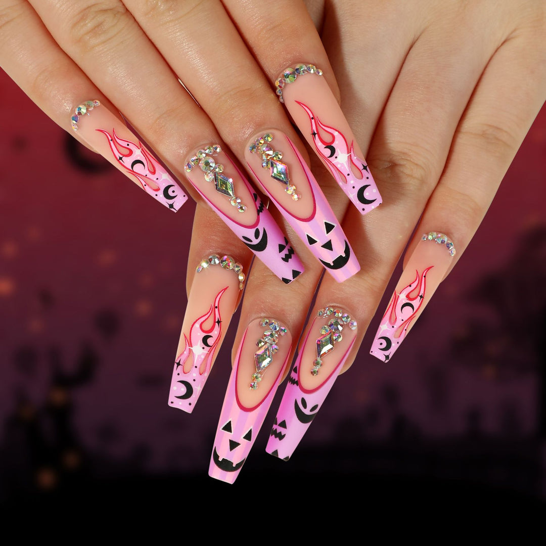 Artificial nail art with festive design and glitter variations Stornfield