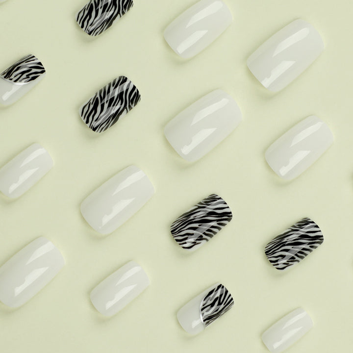 Artful nail extensions with stylish zebra pattern Stornfield