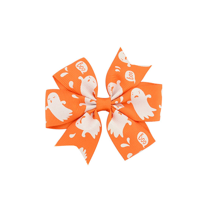 Halloween bow with pumpkin and witch motifs
