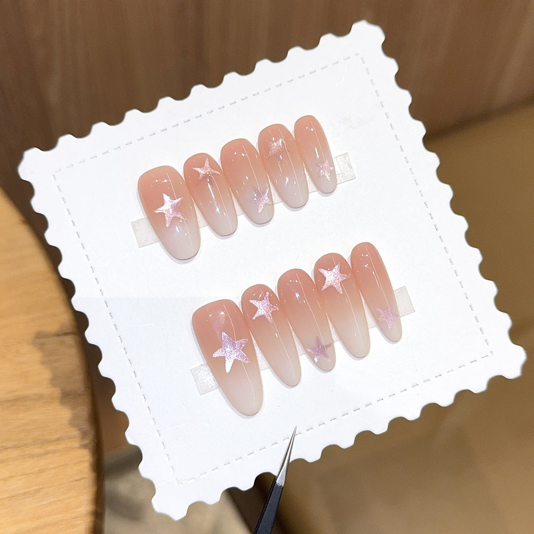 Artificial nails with sparkling stars and gentle gradient Stornfield