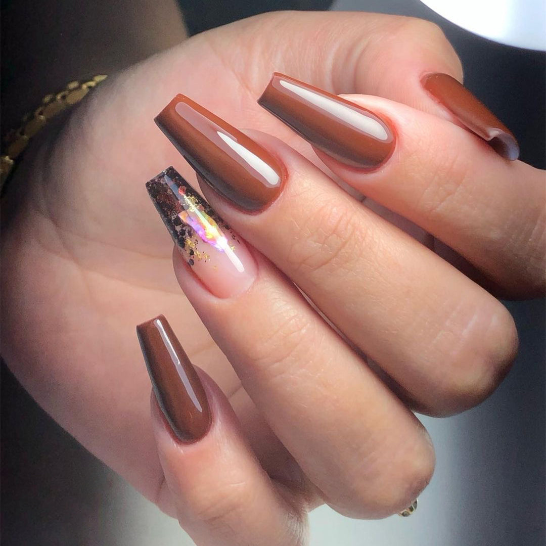 Artificial acrylic nails with elegant glitter accents and creative designs Stornfield