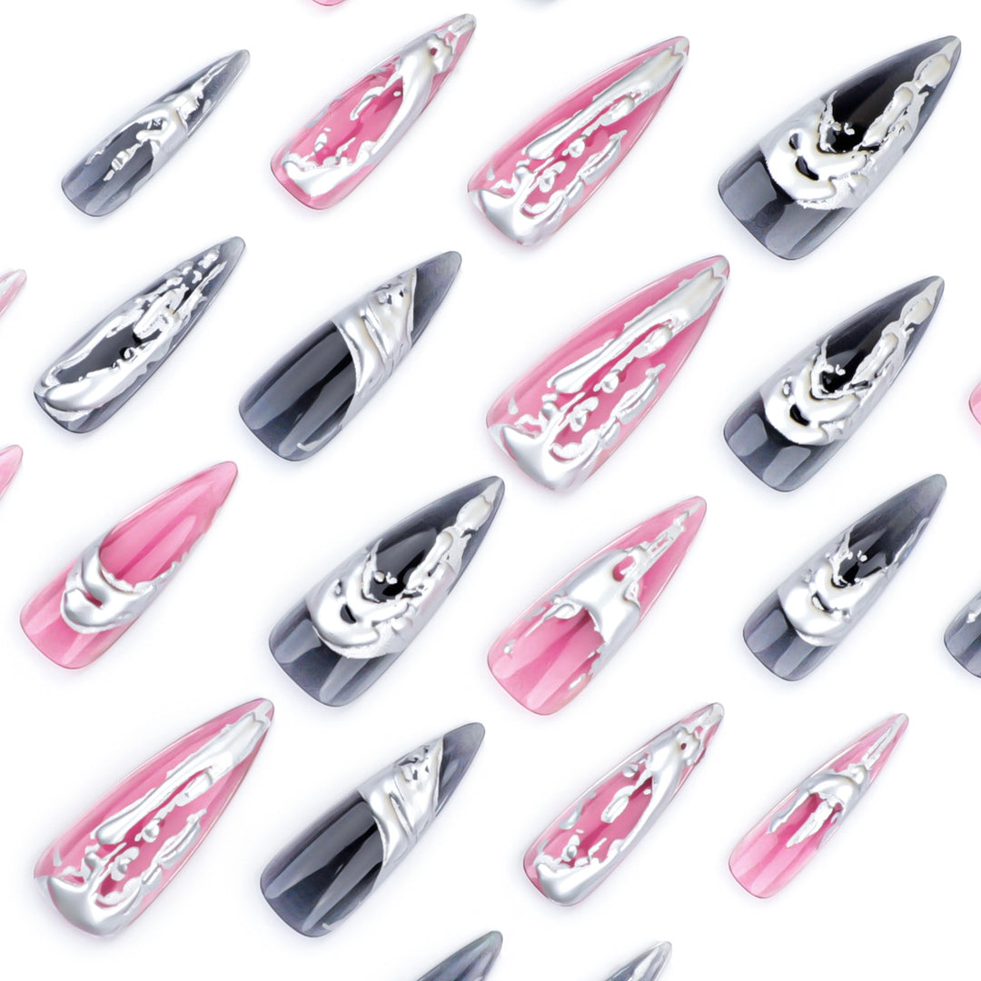 Creative stiletto nails with unique metallic details Stornfield