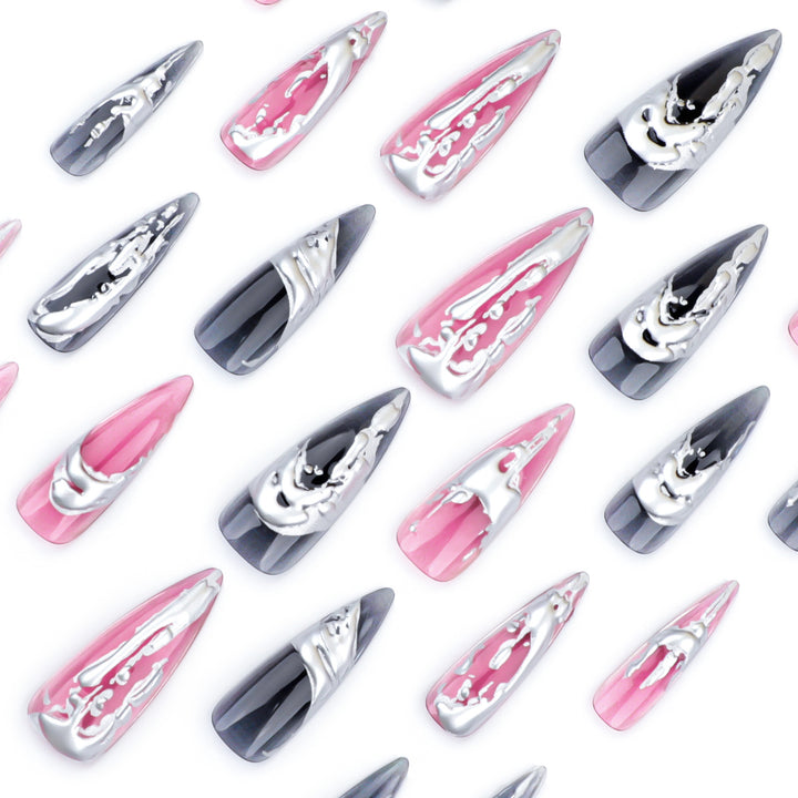 Creative stiletto nails with unique metallic details Stornfield